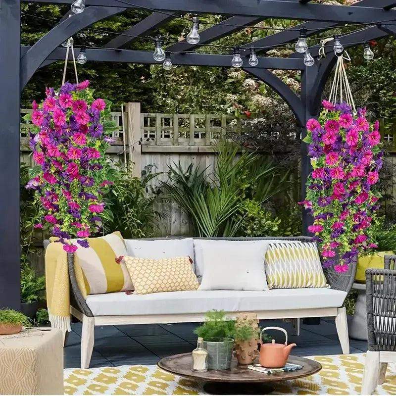Vibrant artificial hanging silk flowers in pink cascading from a pergola, enhancing outdoor patio decor.
